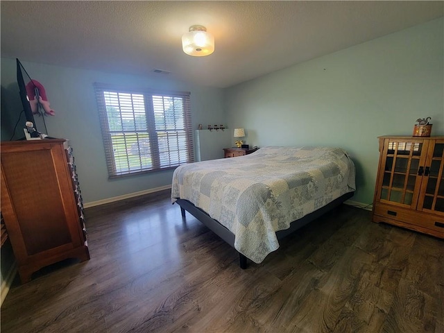 19823 74th St, Mclouth, KS 66054 - bedroom with dark wood-style floors