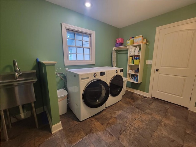 19823 74th St, Mclouth, KS 66054 - laundry room featuring washing machine and dryer, dark stone finish flooring, and recessed lighting