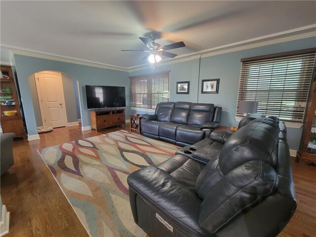 19823 74th St, Mclouth, KS 66054 - living room with arched walkways, ceiling fan, wood finished floors, and ornamental molding
