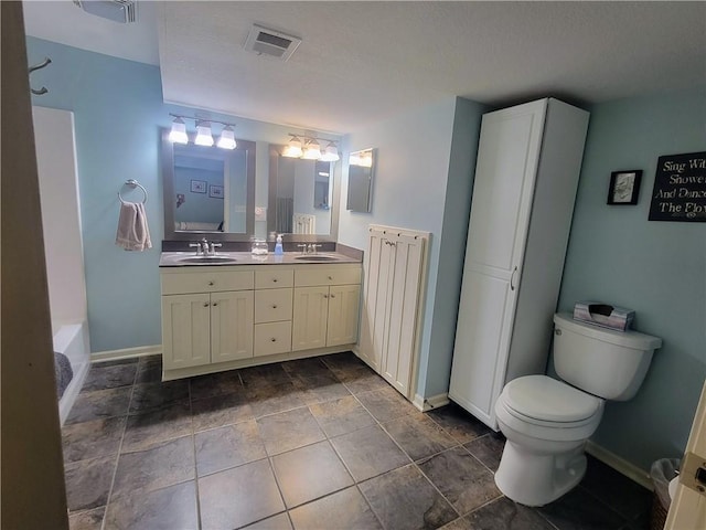 19823 74th St, Mclouth, KS 66054 - bathroom with double vanity, a chandelier, and a bathtub