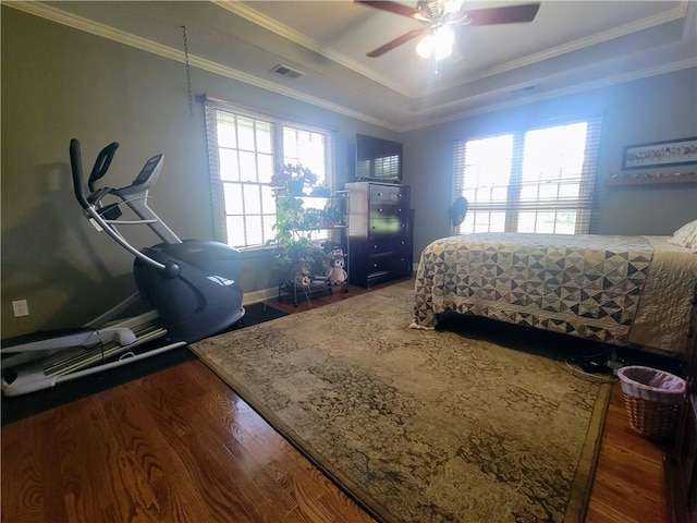 19823 74th St, Mclouth, KS 66054 - bedroom featuring wood finished floors, a tray ceiling, ornamental molding, and a ceiling fan