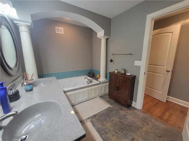19823 74th St, Mclouth, KS 66054 - full bathroom with decorative columns, double vanity, and a jetted tub