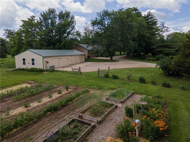19823 74th St, Mclouth, KS 66054 - view of yard with a vegetable garden, driveway, and an outdoor structure