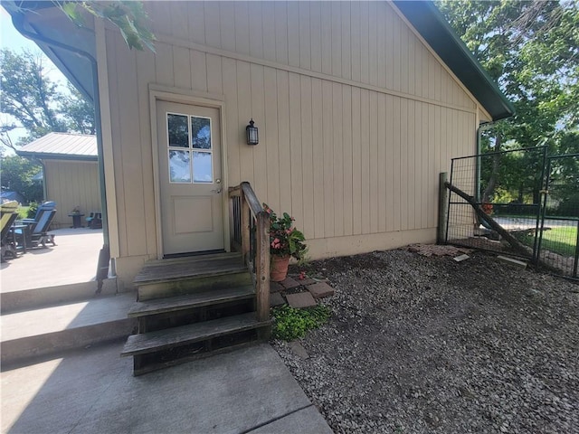 19823 74th St, Mclouth, KS 66054 - view of exterior entry with a gate and a patio area