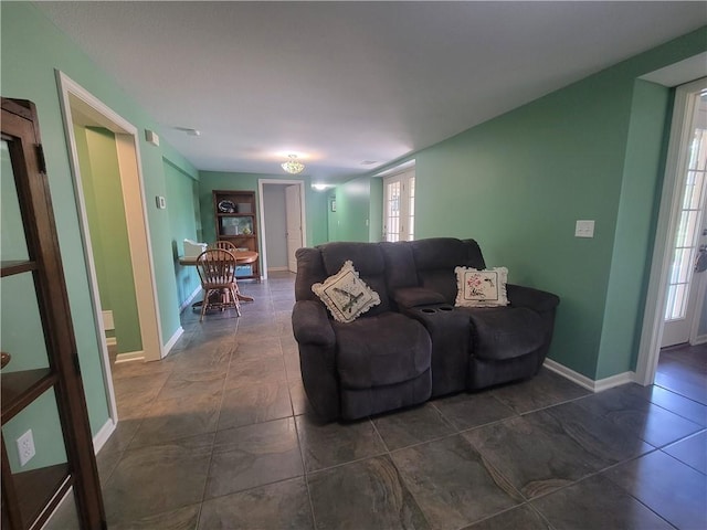 19823 74th St, Mclouth, KS 66054 - tiled living area featuring baseboards