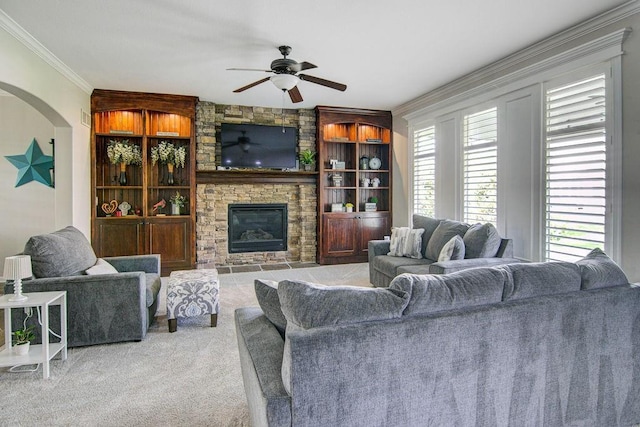 16324 S Locust St, Olathe, KS 66062 - living room with ornamental molding, carpet, ceiling fan, a fireplace, and built in features