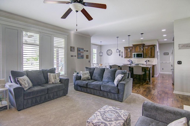 16324 S Locust St, Olathe, KS 66062 - living room with ceiling fan, recessed lighting, crown molding, and wood finished floors