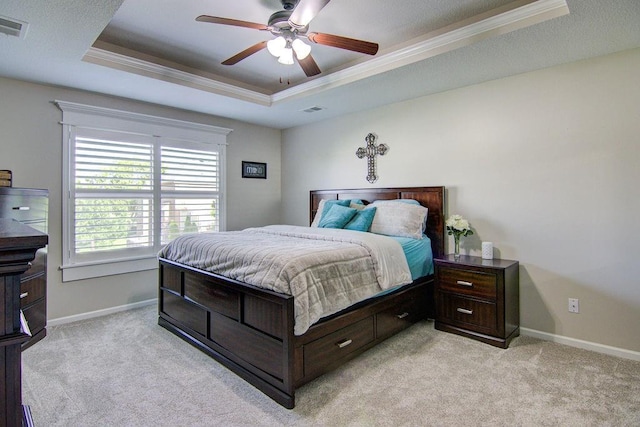 16324 S Locust St, Olathe, KS 66062 - bedroom with a tray ceiling, ornamental molding, light colored carpet, and a ceiling fan