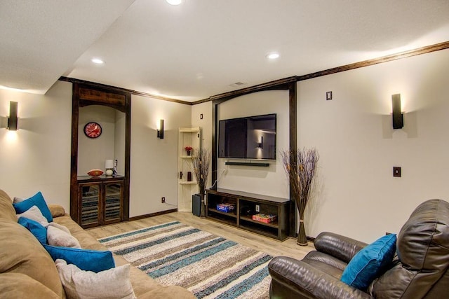 16324 S Locust St, Olathe, KS 66062 - living room with wood finished floors, ornamental molding, and recessed lighting