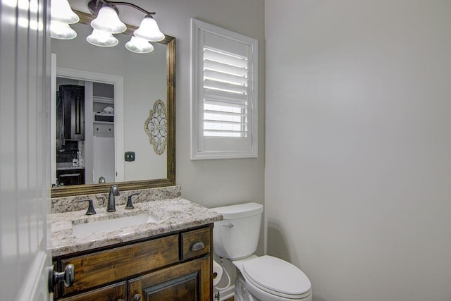 16324 S Locust St, Olathe, KS 66062 - half bath featuring vanity and a chandelier