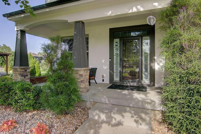 16324 S Locust St, Olathe, KS 66062 - view of exterior entry featuring covered porch and stucco siding