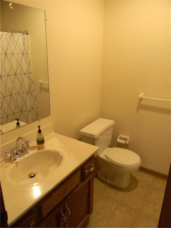 730 SE 10th St, Lees Summit, MO 64081 - bathroom with vanity, tile patterned flooring, and a shower with shower curtain