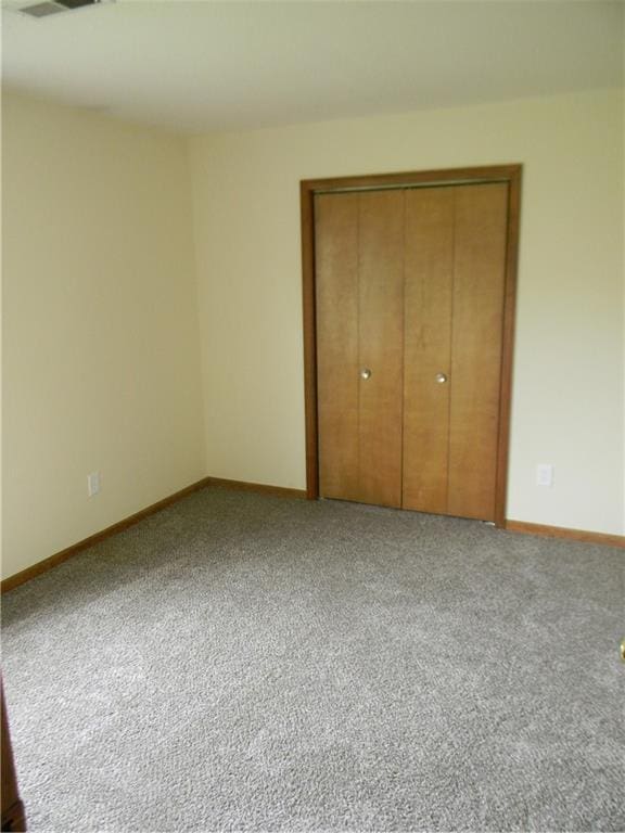 730 SE 10th St, Lees Summit, MO 64081 - unfurnished bedroom featuring carpet and a closet