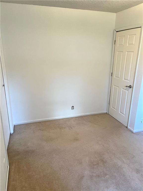 177 1150th St, Humboldt, KS 66748 - unfurnished room with light colored carpet and a textured ceiling
