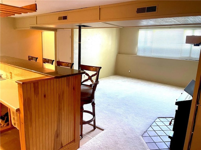 177 1150th St, Humboldt, KS 66748 - dining room with light carpet and a bar