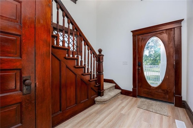 308 W Pine St, Cherokee, KS 66724 - foyer featuring light wood-style floors and stairs