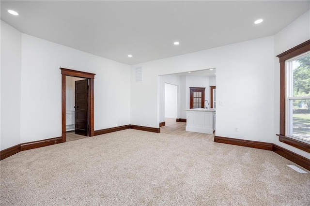 308 W Pine St, Cherokee, KS 66724 - empty room with light colored carpet and recessed lighting