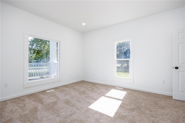 308 W Pine St, Cherokee, KS 66724 - carpeted spare room featuring plenty of natural light and recessed lighting