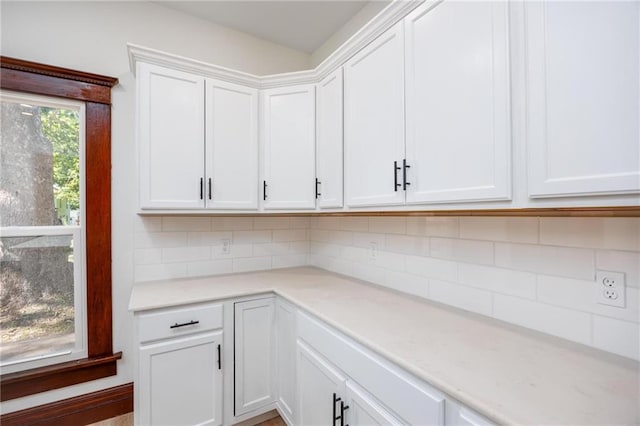 308 W Pine St, Cherokee, KS 66724 - kitchen with white cabinets and decorative backsplash