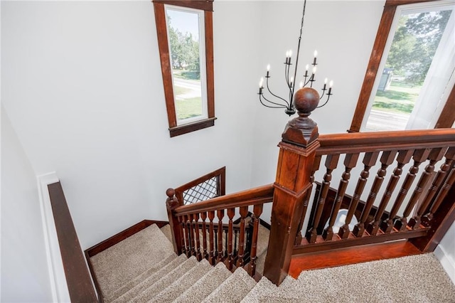 308 W Pine St, Cherokee, KS 66724 - stairs with carpet floors, healthy amount of natural light, and a chandelier