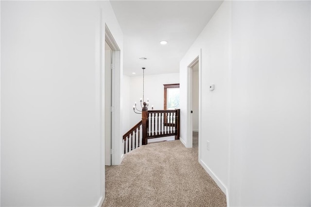 308 W Pine St, Cherokee, KS 66724 - hall featuring an upstairs landing, a chandelier, carpet flooring, and recessed lighting