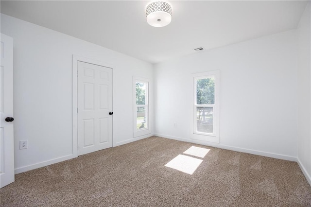 308 W Pine St, Cherokee, KS 66724 - carpeted empty room with baseboards