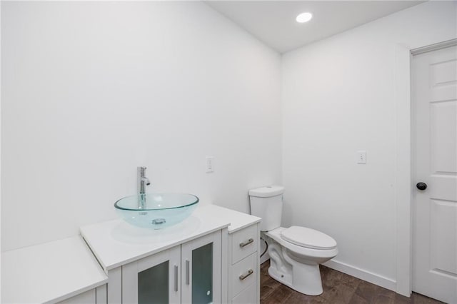 308 W Pine St, Cherokee, KS 66724 - bathroom featuring wood finished floors and vanity