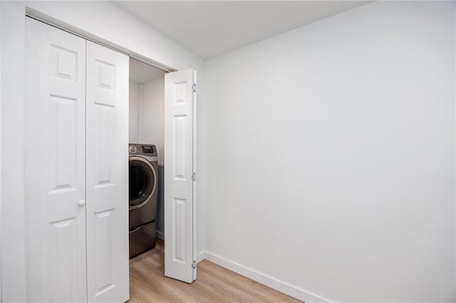 308 W Pine St, Cherokee, KS 66724 - washroom featuring light wood-style floors and washer / dryer