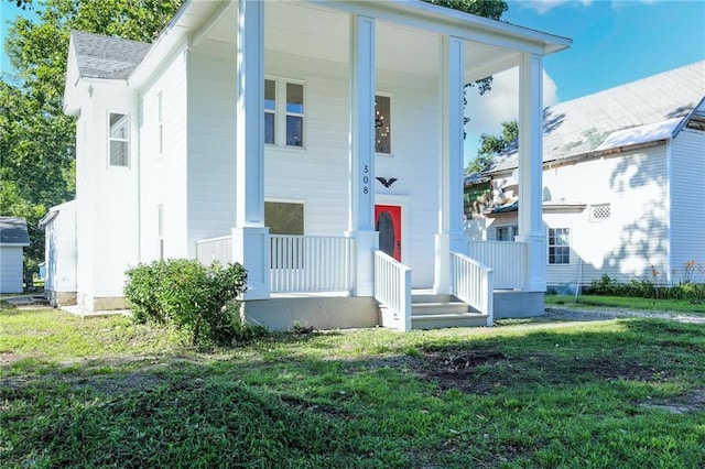 308 W Pine St, Cherokee, KS 66724 - view of front of home with covered porch and a front yard
