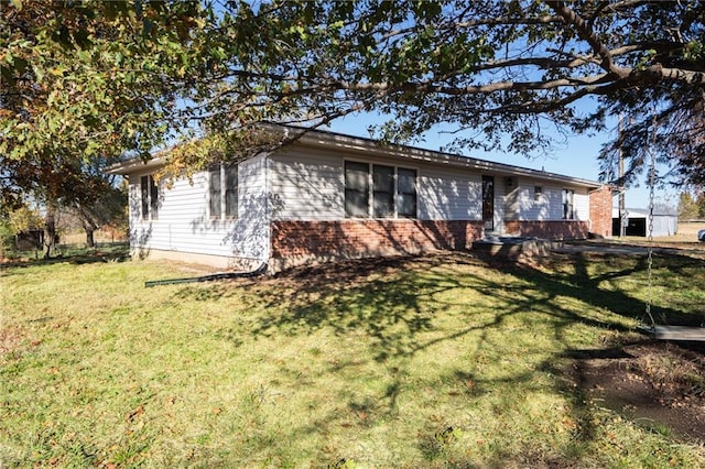 2334 N 100th Rd, Wellsville, KS 66092 - view of property exterior with a lawn and brick siding