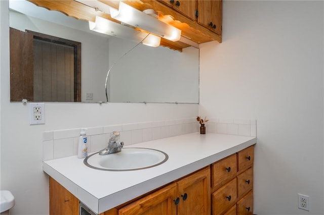 2334 N 100th Rd, Wellsville, KS 66092 - bathroom featuring vanity and tasteful backsplash