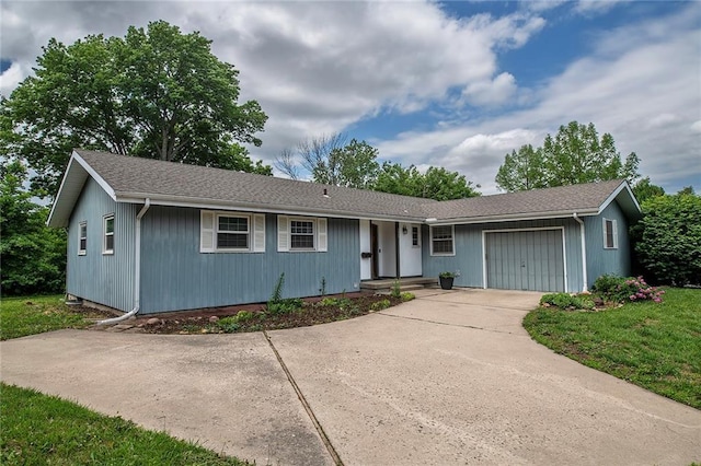 2439 Jasu Dr, Lawrence, KS 66046 - ranch-style house featuring an attached garage, a shingled roof, and concrete driveway