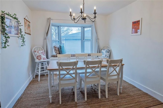 2439 Jasu Dr, Lawrence, KS 66046 - dining area featuring a chandelier and baseboards