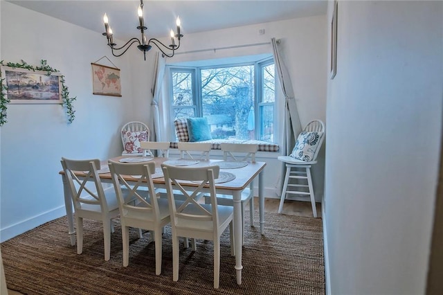 2439 Jasu Dr, Lawrence, KS 66046 - dining room with a chandelier and baseboards