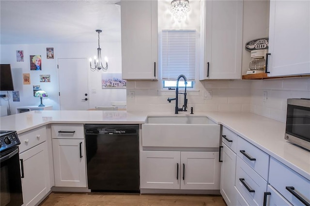 2439 Jasu Dr, Lawrence, KS 66046 - kitchen featuring a chandelier, dishwasher, and light countertops