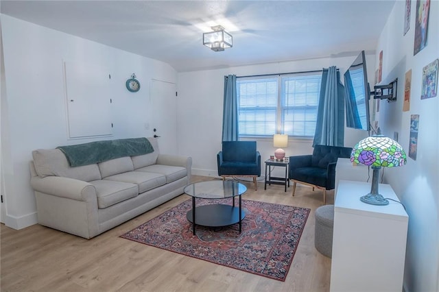 2439 Jasu Dr, Lawrence, KS 66046 - living area featuring wood finished floors and baseboards