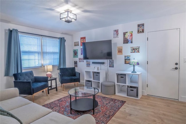 2439 Jasu Dr, Lawrence, KS 66046 - living area featuring light wood-style floors and baseboards