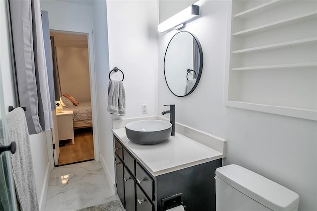 2439 Jasu Dr, Lawrence, KS 66046 - bathroom with marble finish flooring, vanity, and ensuite bathroom