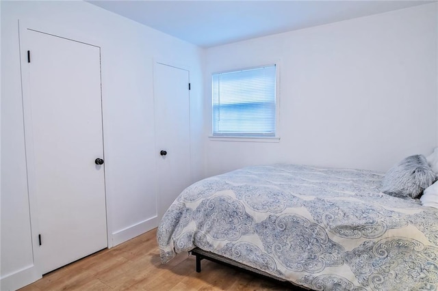 2439 Jasu Dr, Lawrence, KS 66046 - bedroom with light wood-type flooring