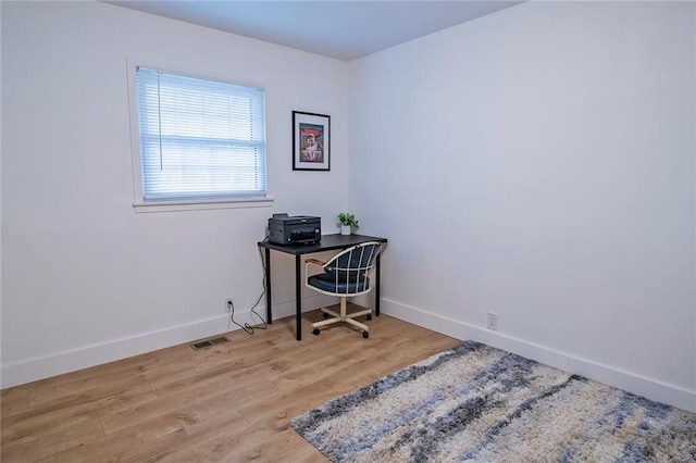 2439 Jasu Dr, Lawrence, KS 66046 - office area featuring baseboards and wood finished floors