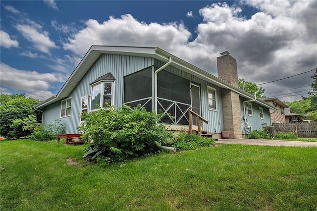 2439 Jasu Dr, Lawrence, KS 66046 - view of home's exterior featuring a chimney