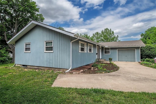2439 Jasu Dr, Lawrence, KS 66046 - single story home featuring an attached garage, a front lawn, and concrete driveway