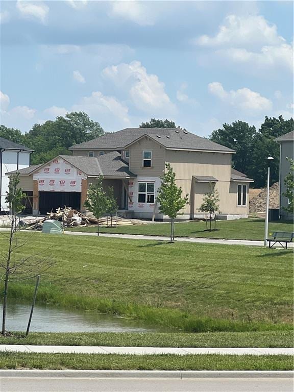 18841 W 169th Ter, Olathe, KS 66062 - view of front of house featuring a water view and a front yard