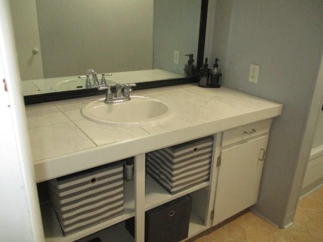 bathroom with vanity and tile patterned floors