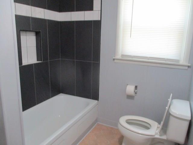 bathroom featuring tile patterned floors and toilet