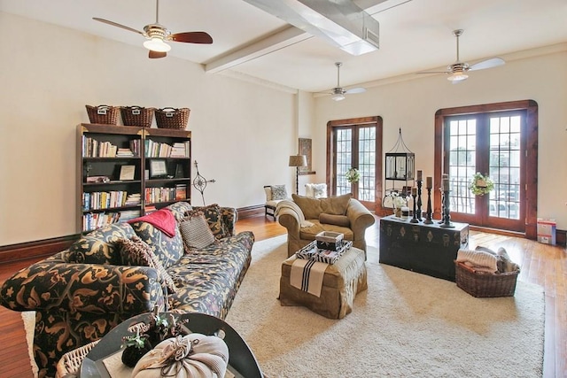 living room with beamed ceiling, ceiling fan, french doors, and wood-type flooring