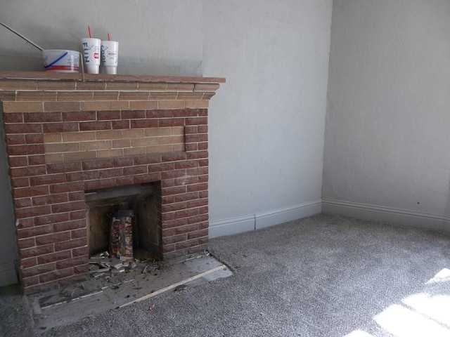 interior space with carpet flooring and a brick fireplace