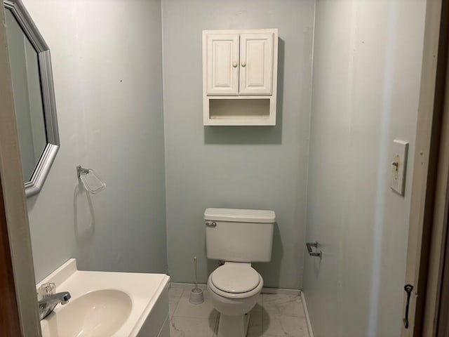 bathroom featuring sink and toilet