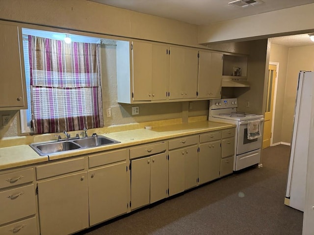 kitchen with white appliances and sink