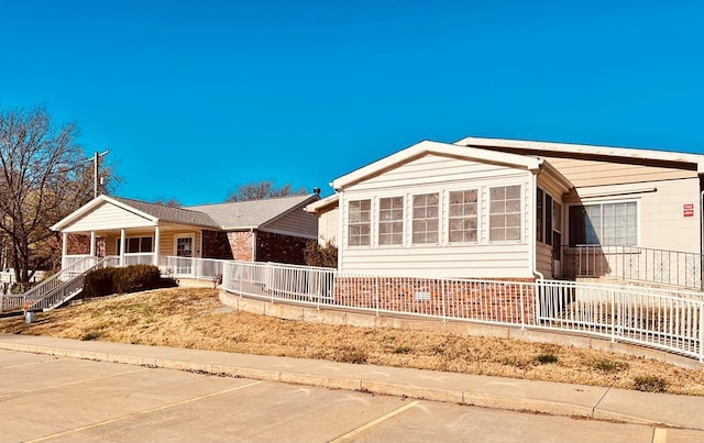 ranch-style home featuring a porch